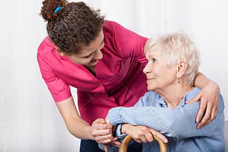 Nurse taking care of senior woman