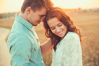 Young couple in love outdoor. Couple hugging.