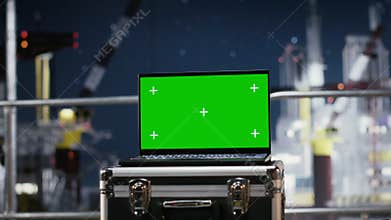 Green screen on laptop supporting offshore drilling rig calibration