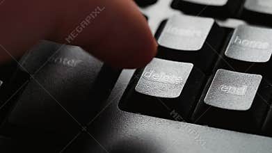 Hitting the Delete key on a desktop pc keyboard