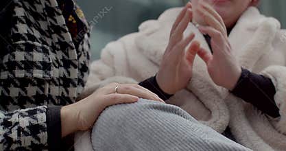 white bride-to-be and asian friend tender bench moment prague