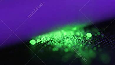 Luminous Green Powder Under Blacklight with Purple Ambient Glow and Dark Textured Surface