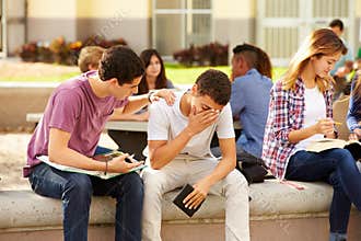 Male High School Student Comforting Unhappy Friend