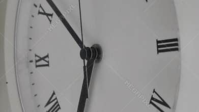 White clock face. Minute and hour hand movement.Running time .The fast running of the hour hand.