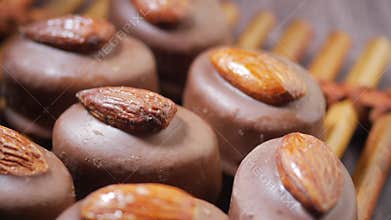 Making chocolate treats with almonds in a kitchen