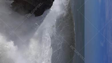 High waves breaking on the rocks of the coastline