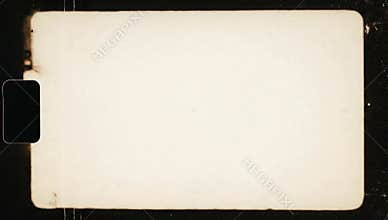 A vintage film frame, horizontally oriented, features a central, off-white rectangle with rounded corners, suggesting aged paper.