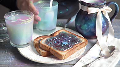 Whimsical pastel brunch scene featuring star-topped toast and pastel beverages on a wooden table