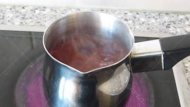 Cacao preparing in metal cezve