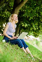 Why employees need to work outdoors. Girl laptop outdoors. Being outdoors exposes workers to fresher air and