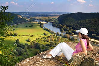Woman on top of a cliff