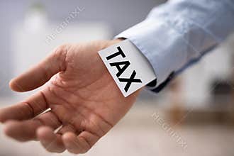 Businessperson Showing Unfair Tax Advantage In His Sleeve