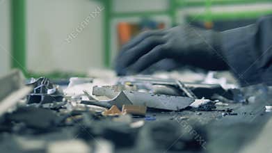 Electronics` debris are being arranged while moving along the belt