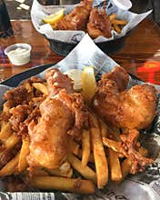 Fish and Chips Served Pub Style in tissue lined baskets.