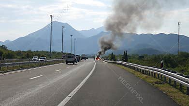 Split, Croatia - 21 June 2016: The car caught fire on the road. Burning car on Autobahn in Croatia A1. Fire blazes
