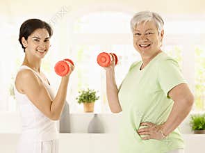 Senior woman doing dumbbell exercise