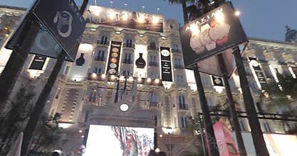France, Cannes, 27 May 2017: The Carlton hotel at evening during Cannes Film festival, branch of palms, famous event