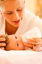 Mother is feeding the baby