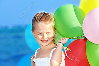 Child playing with balloons .