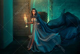 Luxury lady Queen medieval royal dress run escapes from Gothic night castle. Blue silk dress, cloak train plume waving