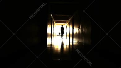 Baby girl walking in dark spooky corridor. Mystical horror with the dead
