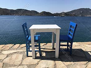 Two Blue Chairs and a Table