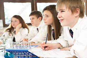 Group Of Teenage Students In Science Class