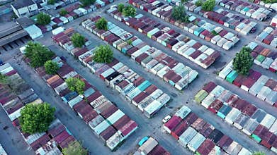 Plenty of abandoned and confiscated containers at a large auction of containers. Aerial panoramic shot.
