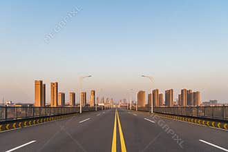 Empty road on downhill approach bridge