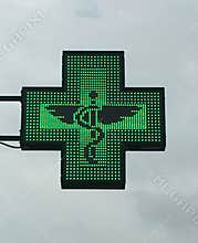 Green cross pharmacy store sign with caduceus. Pharmacy sign.