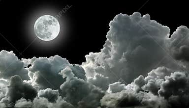 Moon in black clouds
