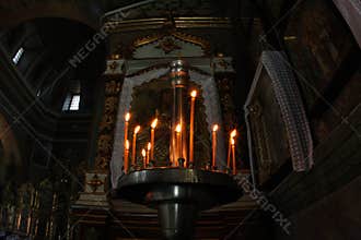 Candle light in dark in Christianity church