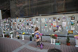 Saint Petersburg Russia a young tourist looks at a spontaneous memorial to doctors who died of covid 19
