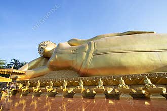 Big golden Buddha statue at Phra Prang Muni temple in Sing Buri province
