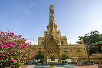 Beautiful golden yellow pagoda at Phra Prang Muni temple in Sing Buri province