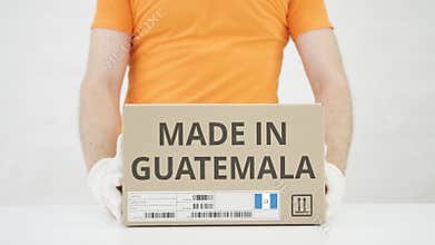 Parcel with MADE IN GUATEMALA text and warehouse worker