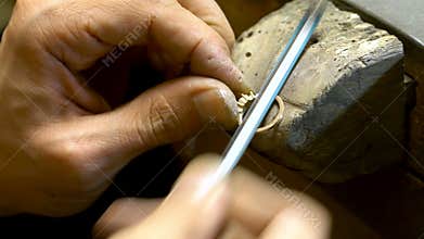 Craftsman making diamond ring. Diamond ring jewelery product. Close up