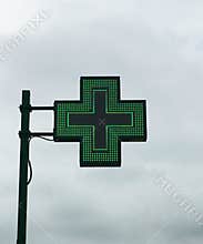 European green cross pharmacy store sign: Farmacia. Pharmacy sign.