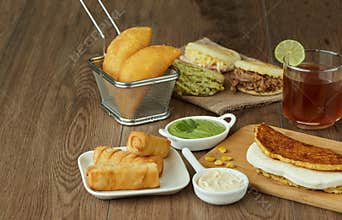 Varied Venezuelan and Colombian food, arepa de choclo, cheese, corn, cachapa arepas venezolanas con rellenos de carne, reina