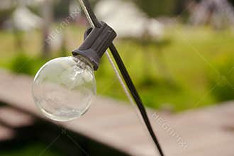 Outdoor string Light bulbs hanging on a line