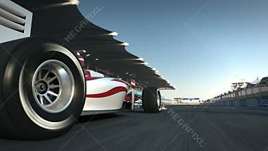 Formula One race car speeding along home stretch and past camera