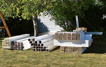 Materials for a new white vinyl privacy fence