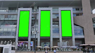 Three Vertical Large Billboard with a Green Screen for Advertising on the Modern Mall
