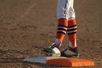 Baseball Player Standing on First Base