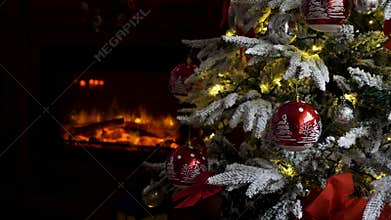 Gorgeous decorated Christmas tree and a fireplace