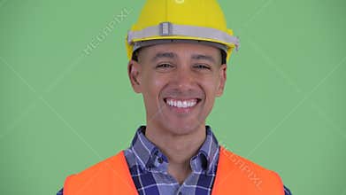 Face of happy multi ethnic man construction worker smiling