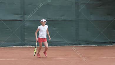 Professional sport, tennis player adolescent girl concentrating and focusing on game then hitting racket on ball at