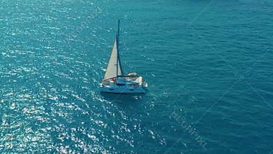 Aerial view. Large sailing catamaran in the open sea.