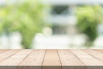 Empty wood table top on blurred background at garden in shopping mall, copy space for montage you product