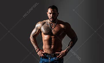Brutal sportsman torso. steroids. sexy abs of tattoo man. male fashion. sport and fitness, health. confidence charisma